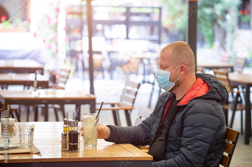 Man in restaurant during coronavirus pandemic.