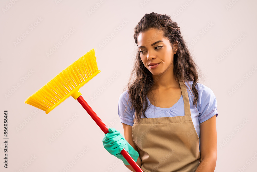 Portrait of african-american housewife who doesn't like cleaning. Portrait of african-american housewife who doesn't like cleaning.