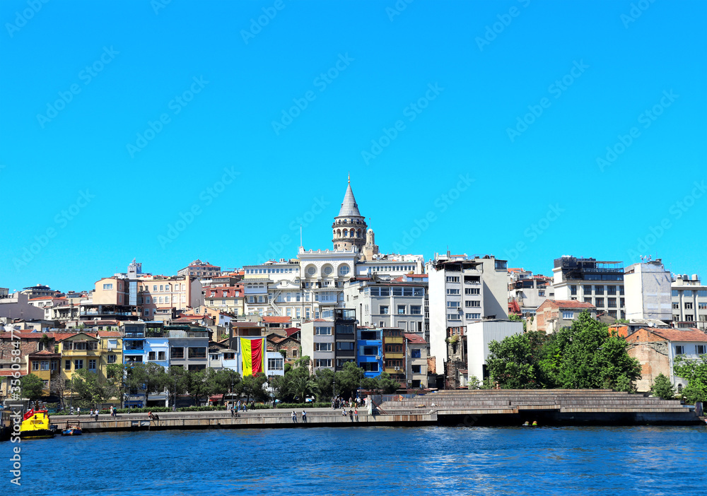 View from water on Galata Tower and Beyoglu district, Istanbul, Turkey