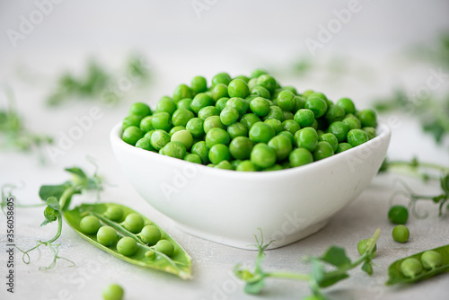 fresh green peas with greens and pea pods