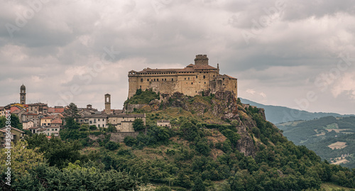 The castle and the village of Bardi in a cloudy day. Parma province, Emilia and Romagna, Italy. photo