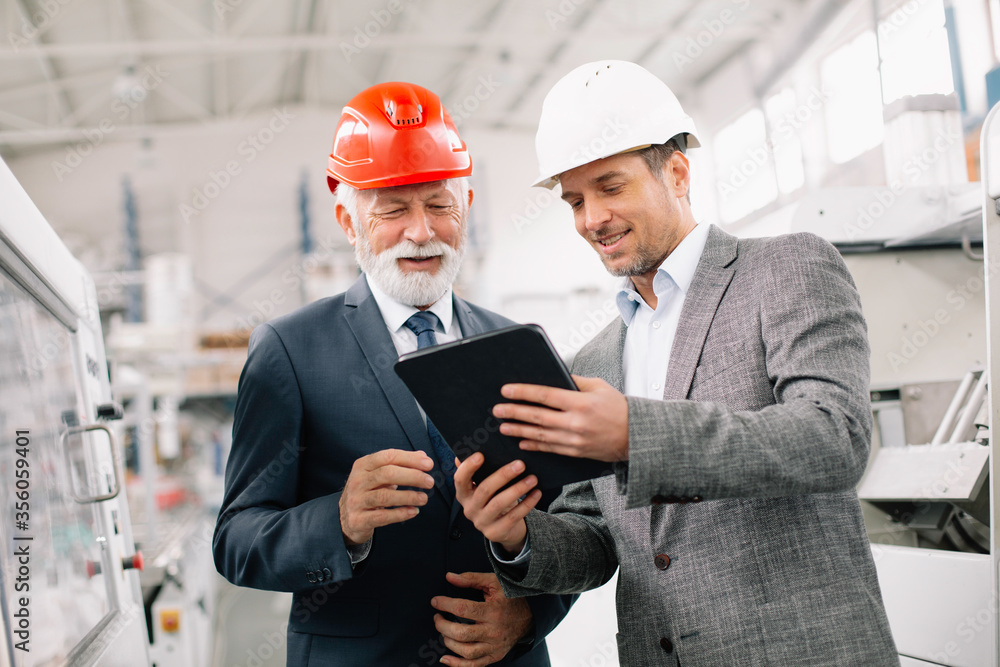Colleagues working together. Arhitects in factory. Colleagues working together. Arhitects in factory.