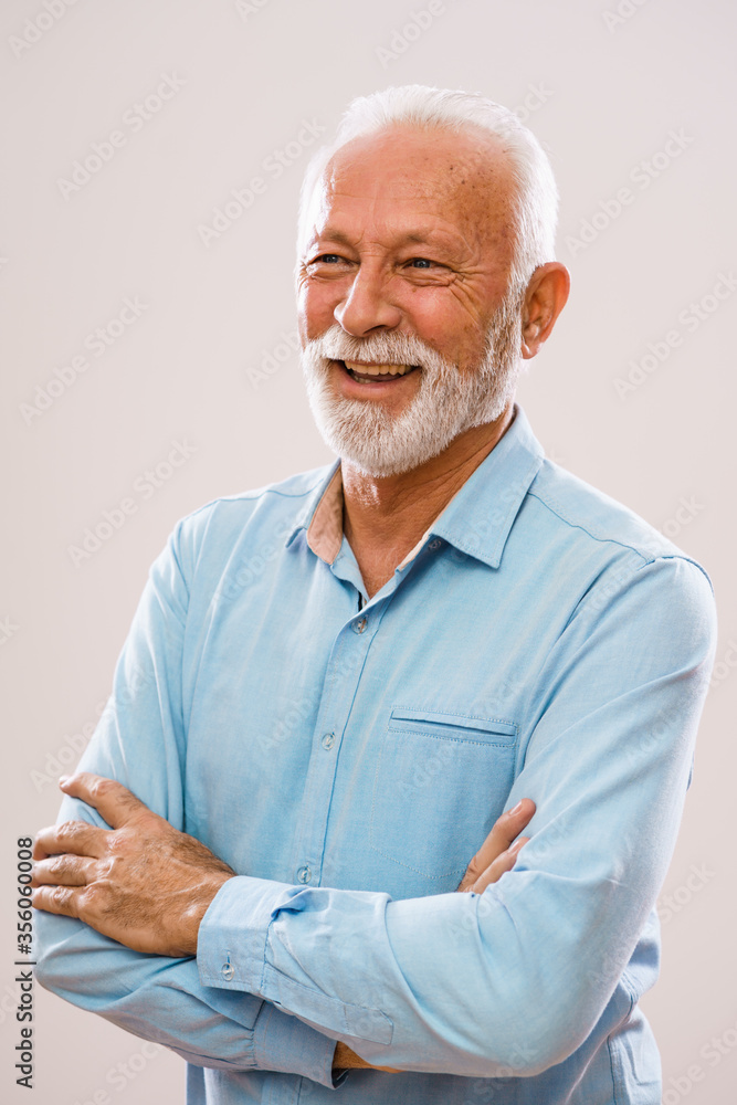 Portrait of cheerful senior man who is looking away. Portrait of cheerful senior man who is looking away.
