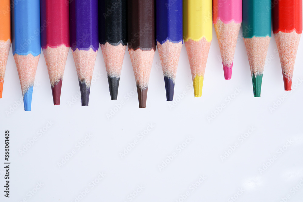 Close up color pencils isolated on white background space for text.
Close up color pencils isolated on white background space for text.
