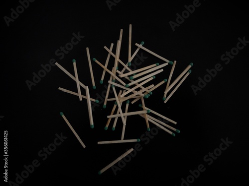 matches scattered on a black table