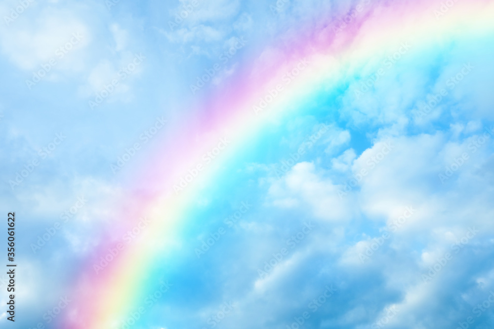 Picturesque view of beautiful rainbow and blue sky on sunny day Picturesque view of beautiful rainbow and blue sky on sunny day