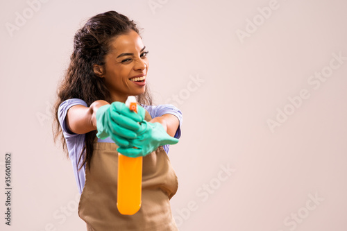 Portrait of happy and successful african-american housewife who is ready for housework.