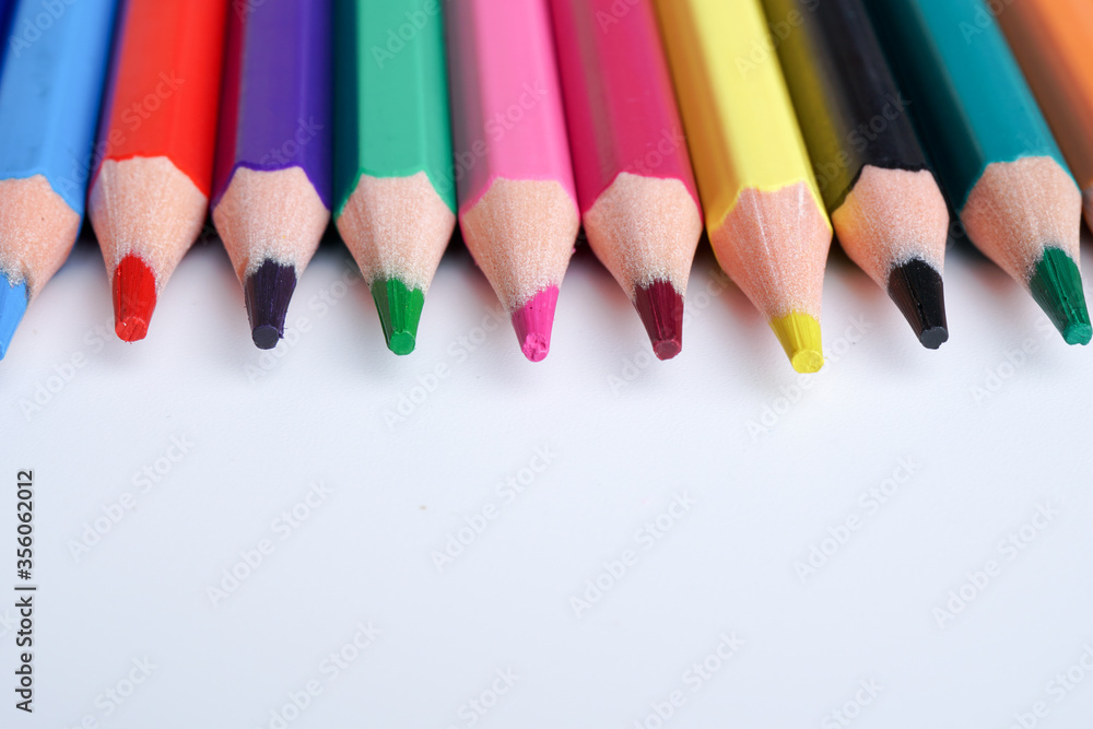 Close up color pencils isolated on white background space for text.
Close up color pencils isolated on white background space for text.