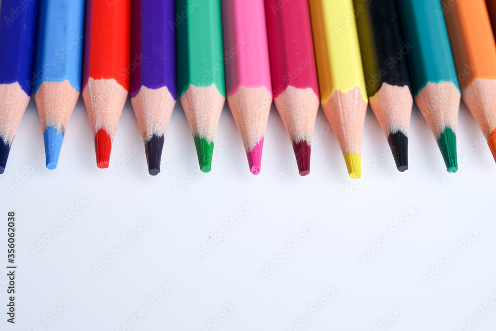Close up color pencils isolated on white background space for text.
Close up color pencils isolated on white background space for text.