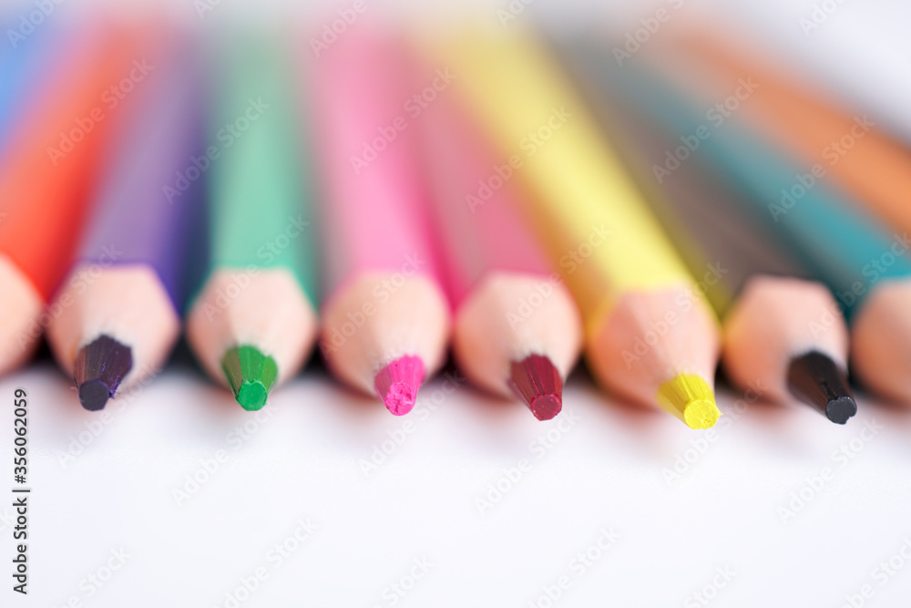 Close up color pencils isolated on white background space for text.
Close up color pencils isolated on white background space for text.