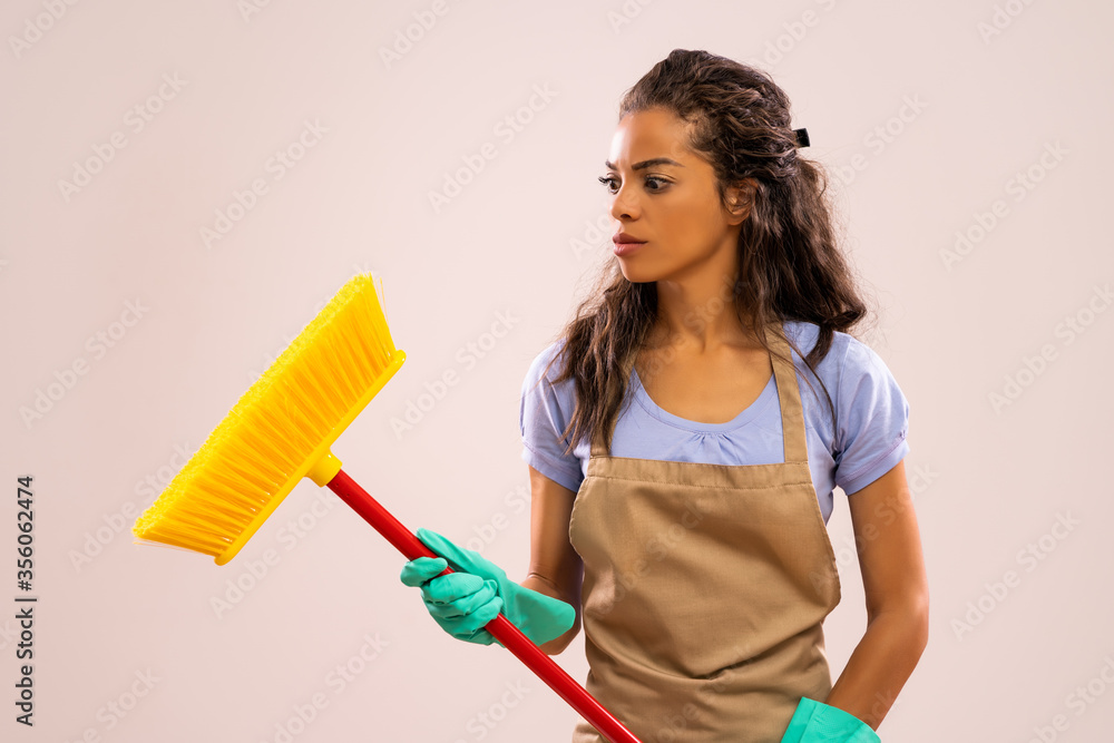 Portrait of african-american housewife who doesn't like cleaning. Portrait of african-american housewife who doesn't like cleaning.