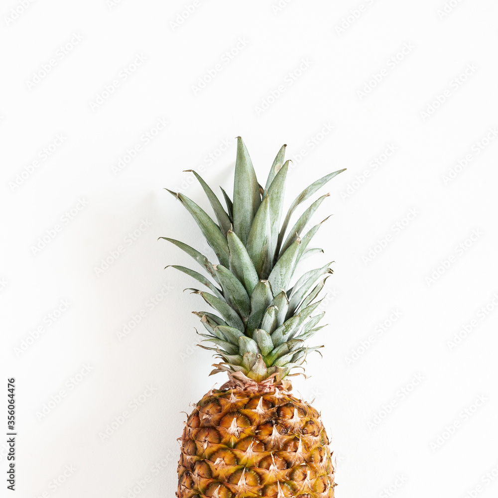 Fototapeta premium Pineapple on white background. Summer concept. Flat lay, top view, square