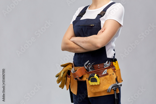 Bilde på lerret repair, construction and building concept - woman or builder with working tools