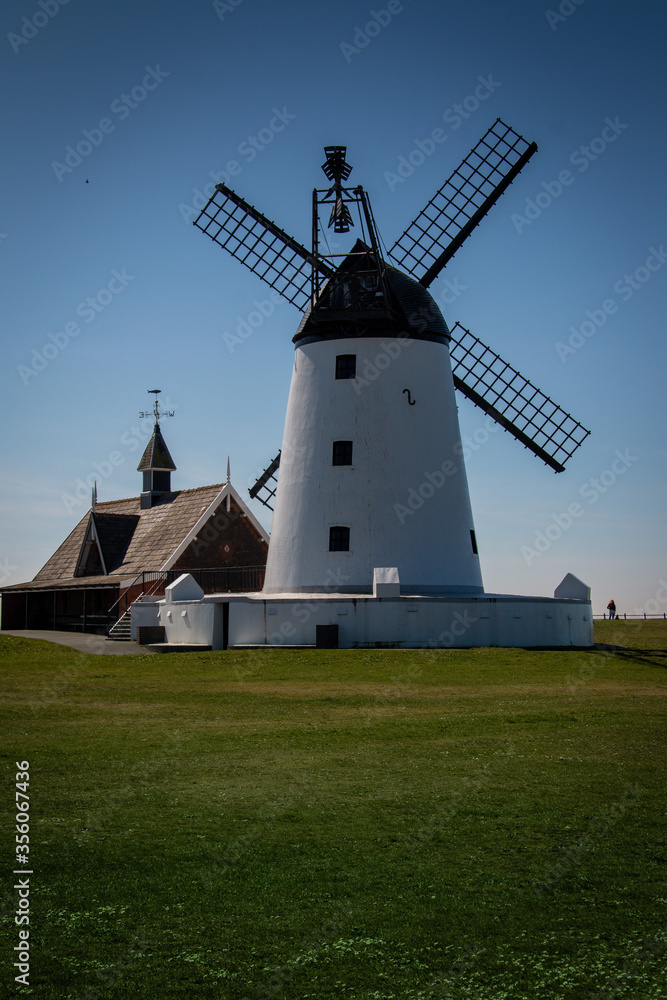 Windmill in Lytham St Anne’s, Lancashire UK green fields and blue sky