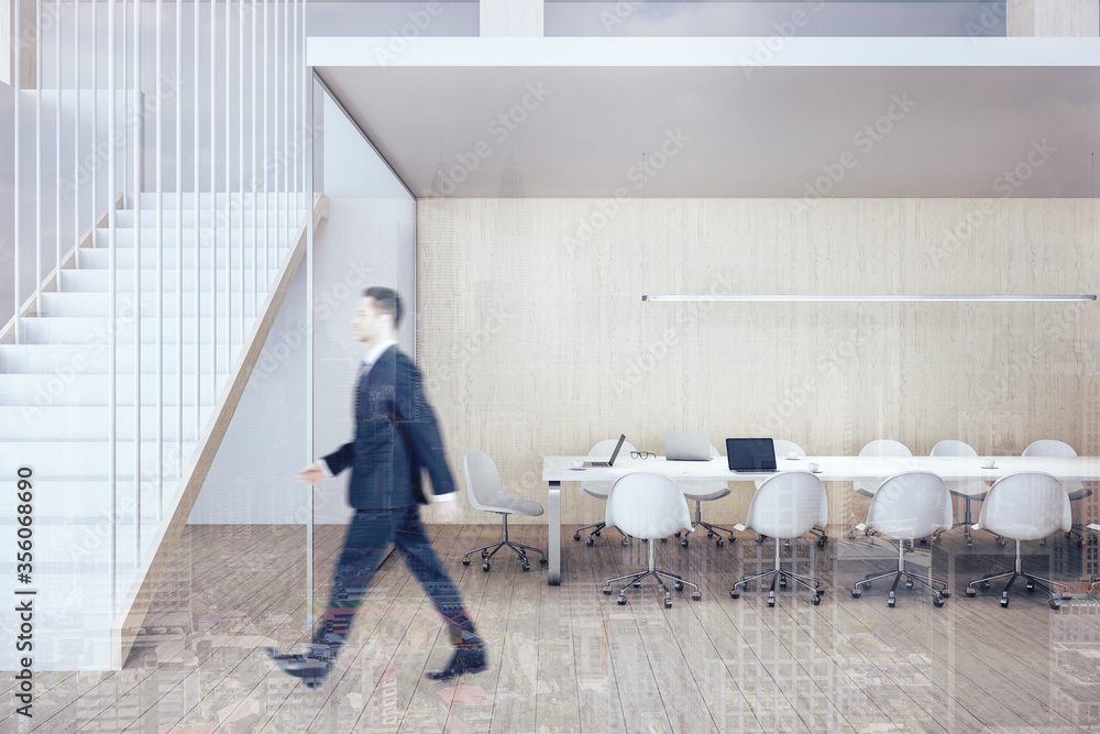 Businessman walking in modern conference interior