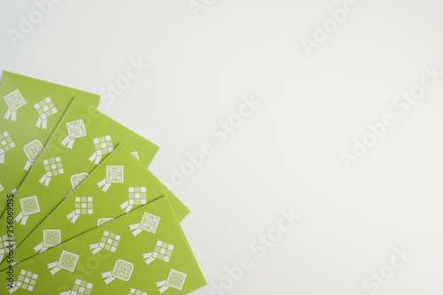 'Duit Raya' is money given from adult to children during Eid al-Fitr celebration in Malaysia. This is a Malay tradition and regarded as alms to the children
