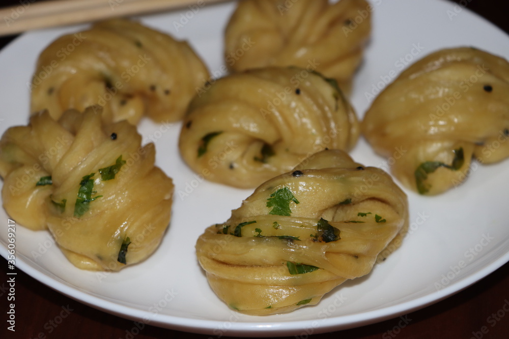 Steamed bread, typically made from wheat, prepared by steaming Steamed bread, typically made from wheat, prepared by steaming