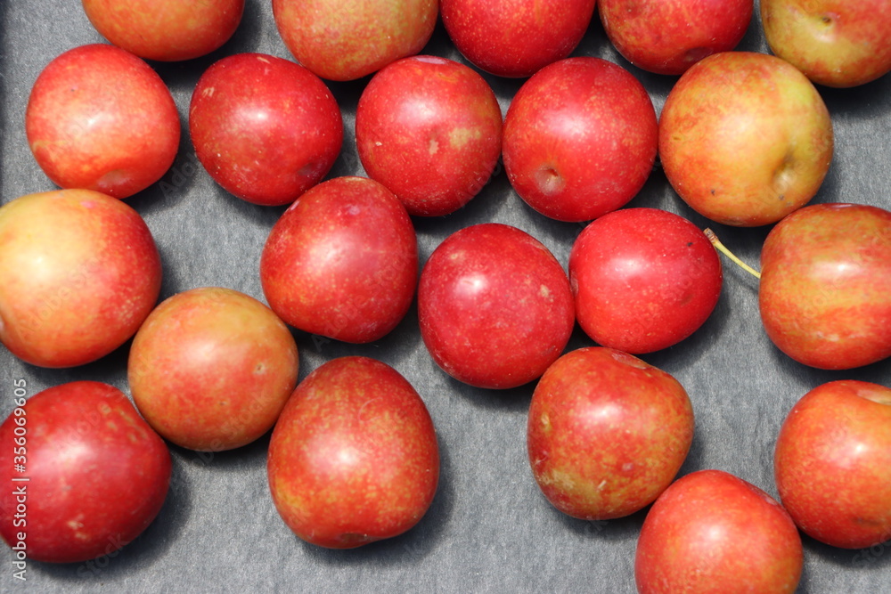 Fresh plum fruits on black background Fresh plum fruits on black background