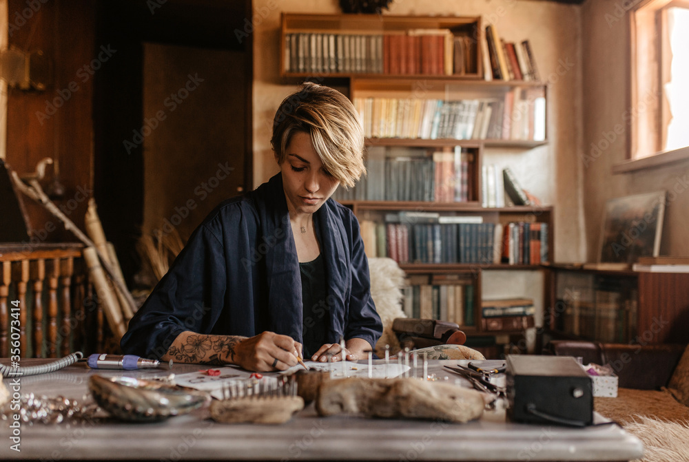 woman working in a workshop and making jewelry
