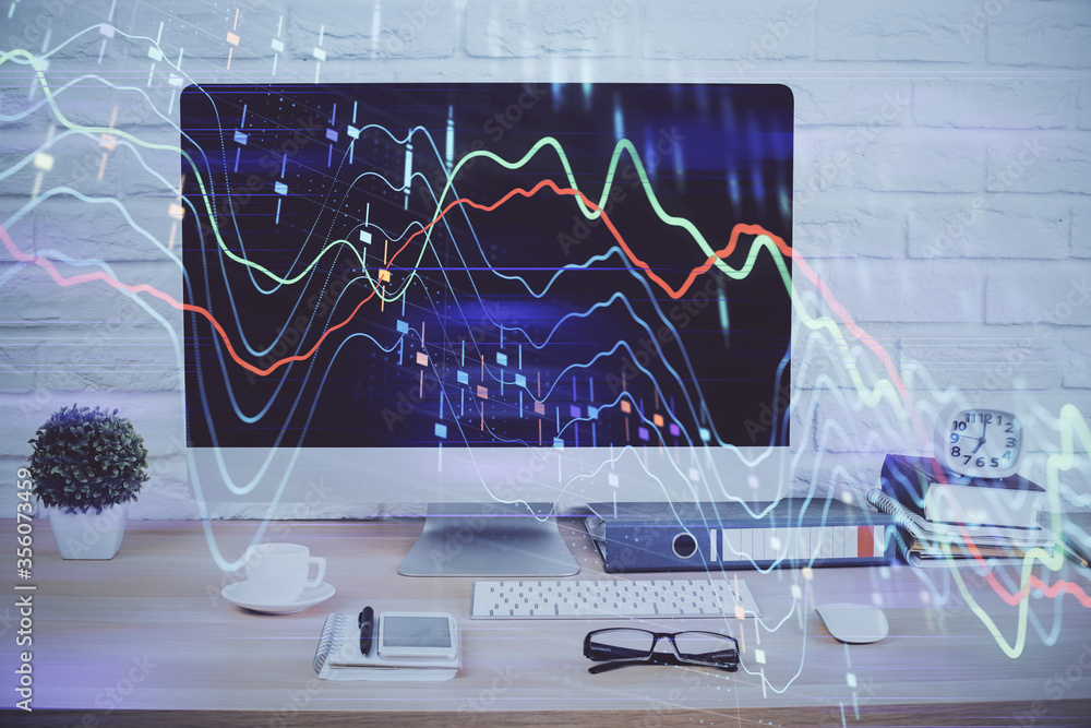 Forex graph hologram on table with computer background. Double exposure. Concept of financial markets. Forex graph hologram on table with computer background. Double exposure. Concept of financial markets.