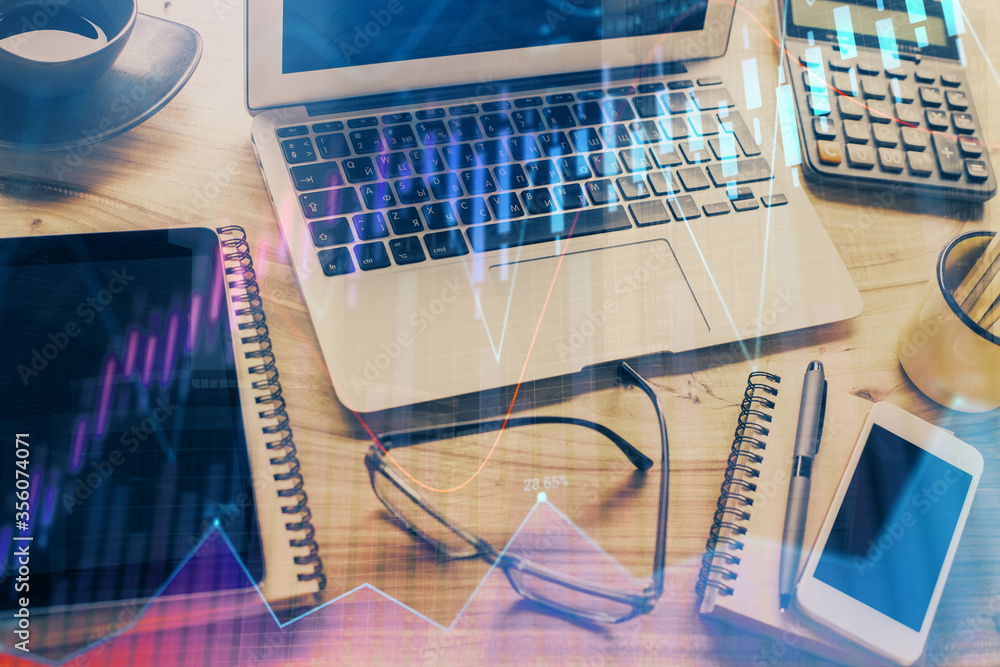 Financial graph colorful drawing and table with computer on background. Multi exposure. Concept of international markets. Financial graph colorful drawing and table with computer on background. Multi exposure. Concept of international markets.