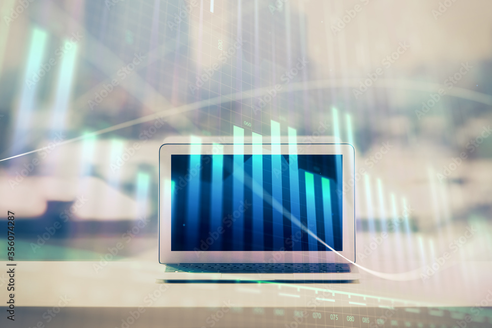 Forex graph hologram on table with computer background. Multi exposure. Concept of financial markets. Forex graph hologram on table with computer background. Multi exposure. Concept of financial markets.