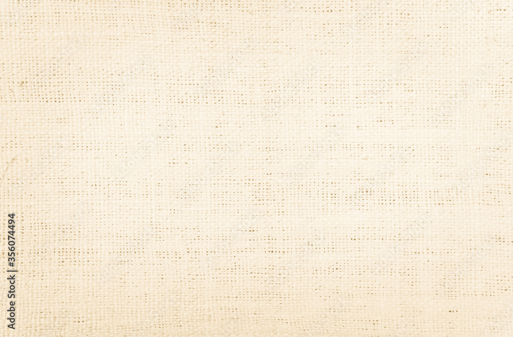 Cream natural linen fabric texture background. Beige cotton cloth wall Cream natural linen fabric texture background. Beige cotton cloth wall
