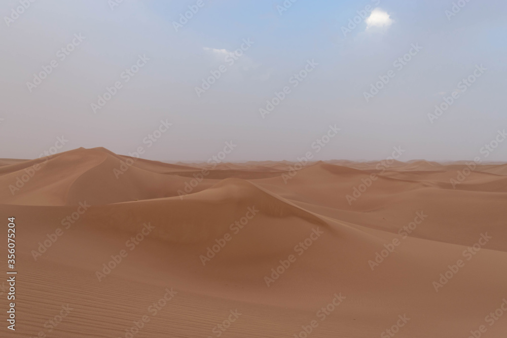 Sahara's dunes with blue sky