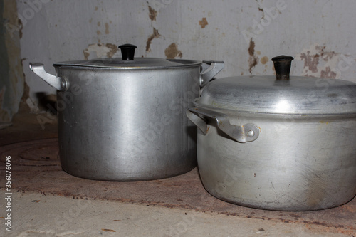 Aluminium pots on wood burning stove