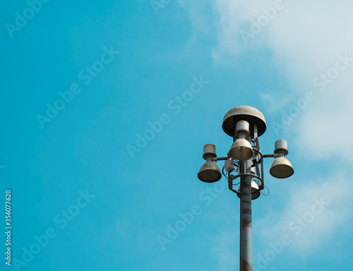 Signal tower or telecommunication tower on blue sky.