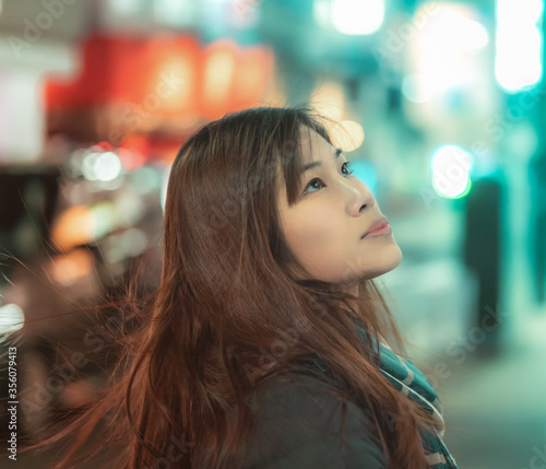 Closed up portrait shot of Asian woman with bokeh background photo