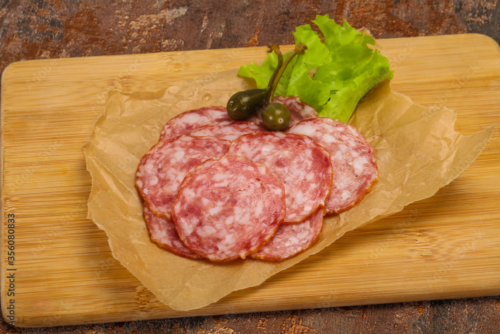 Spanish Salchichon sausage with salad Spanish Salchichon sausage with salad
