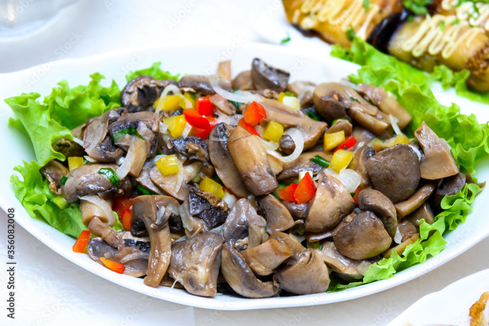 Salad of mushrooms, lettuce and sweet pepper. Festive mushroom salad. Salad of mushrooms, lettuce and sweet pepper. Festive mushroom salad.