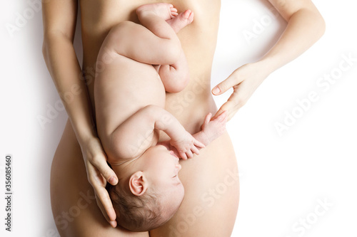 Wallpaper Mural Cute newborn baby lying on the mother belly Torontodigital.ca