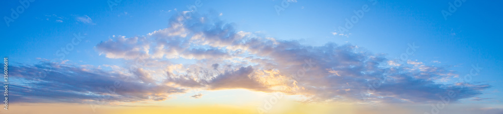 Sunset sky clouds background. Beautiful landscape with clouds and orange sun on sky