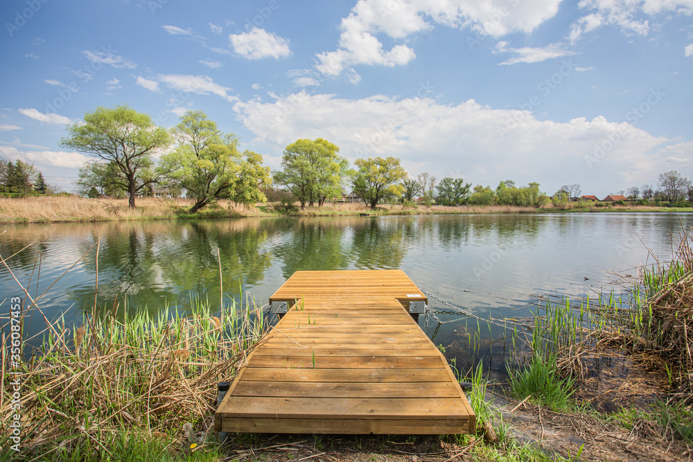 Beautiful lake with a bridge with a view over the lake and trees Beautiful lake with a bridge with a view over the lake and trees