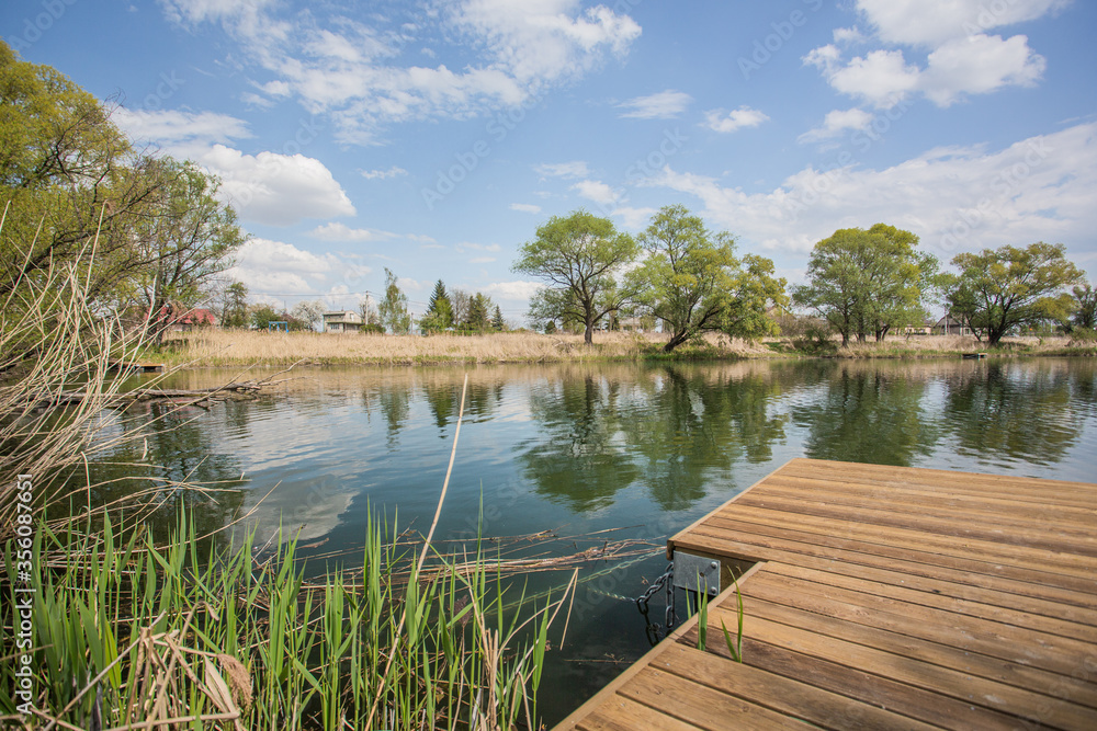 Beautiful lake with a bridge with a view over the lake and trees Beautiful lake with a bridge with a view over the lake and trees