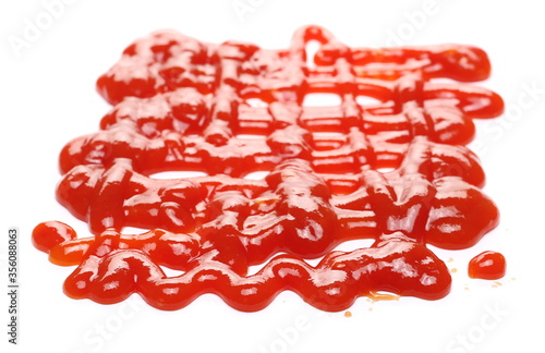 Red ketchup sauce, spread isolated on white background, tomato puree texture