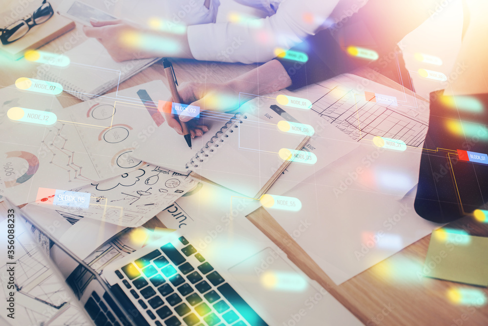 Double exposure of woman's writing hand on background with data technology hud. Big data concept. Double exposure of woman's writing hand on background with data technology hud. Big data concept.