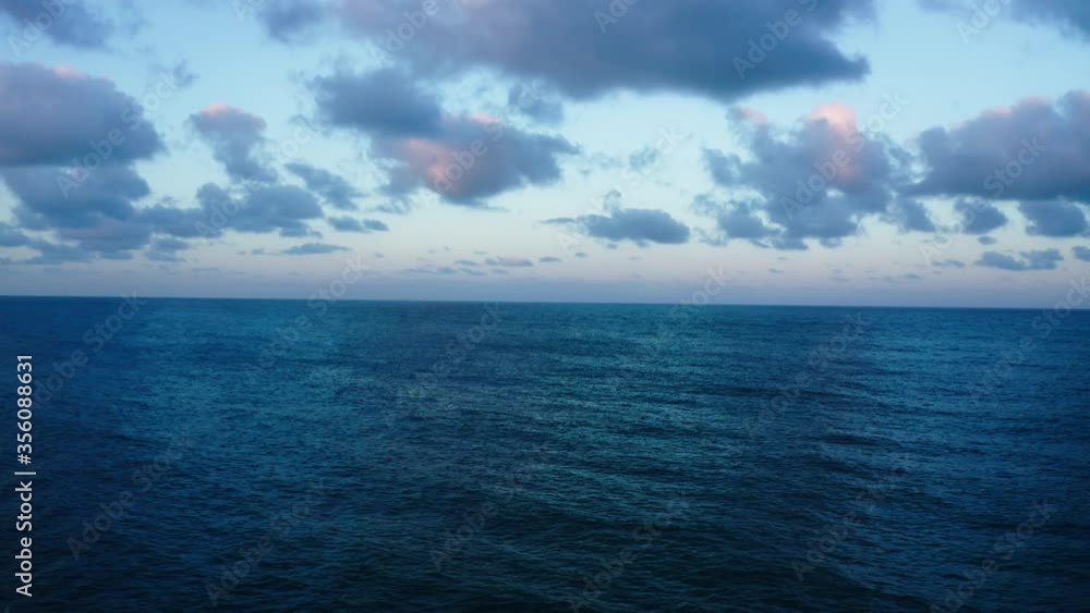 Drone view of the ocean with the clouds in the morning at the sunrise. Drone view of the ocean with the clouds in the morning at the sunrise.