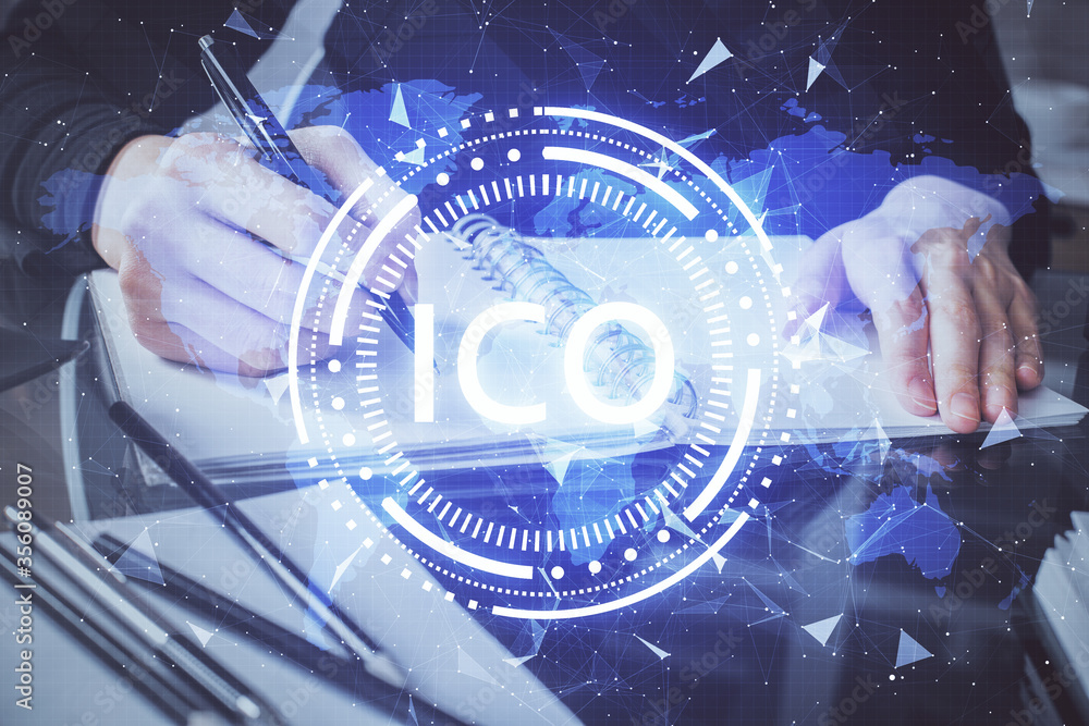 Cryptocurrency hologram over woman's hands writing background. Concept of blockchain. Multi exposure Cryptocurrency hologram over woman's hands writing background. Concept of blockchain. Multi exposure