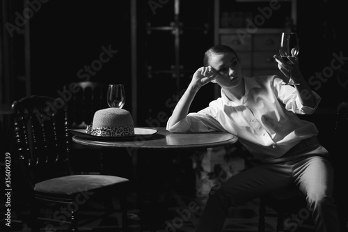 Wallpaper Mural Black and white portrait of beautiful dancing caucasian girl with dramatical emotion on the stage.Retro fashion. Black and white image. Torontodigital.ca