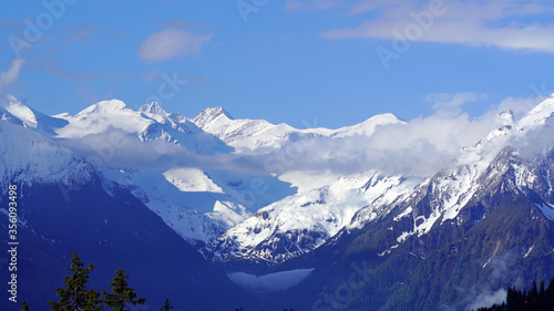 cloudy and sunny morning on the mountains in spring with view to the alps in austria