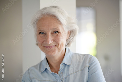 Portrait of smiling senior woman with white hair