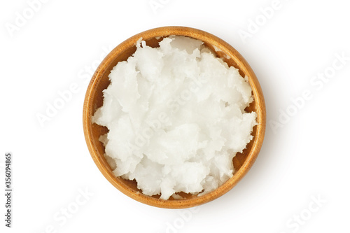Coconut oil in wooden bowl on white background