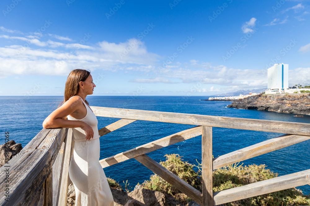 Young woman enjoying walking on Tenerife coast