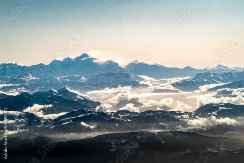 Sunrise over Mont Blanc mountain range from a plane above french alps © Adrien