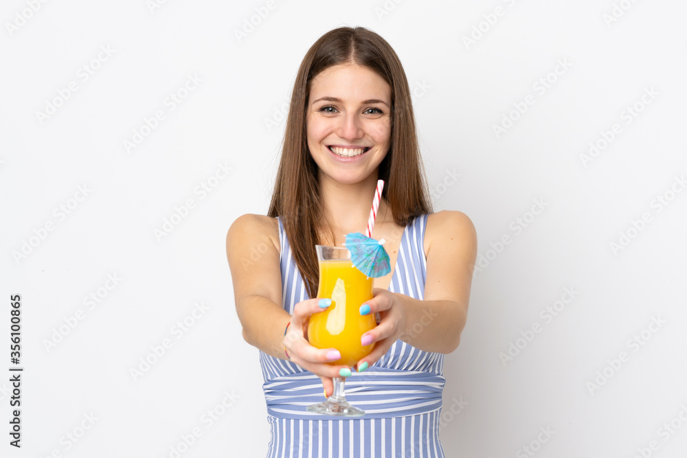 Young caucasian woman isolated on white background in swimsuit and holding a cocktail Young caucasian woman isolated on white background in swimsuit and holding a cocktail