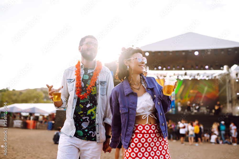 Couple with beer at music festival.  Summer Beach party, holiday, vacation concept.