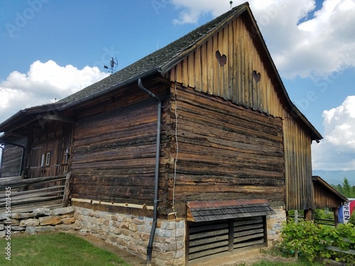 large old wooden barn with two hearts